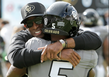 Deion Sanders hugs Jimmy Horn