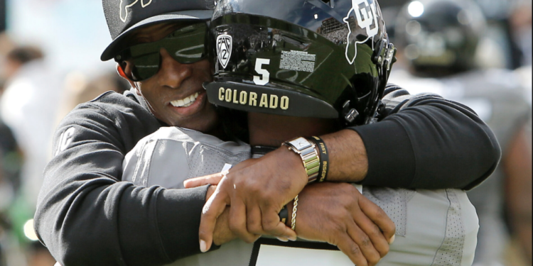 Deion Sanders hugs Jimmy Horn
