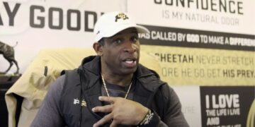 coach prime talking in his office